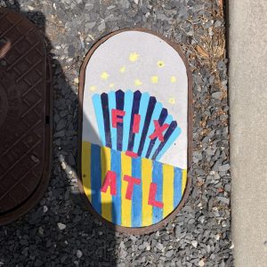 Anonymous account uses art to fill holes and create a rallying cry: ‘Fix ATL’